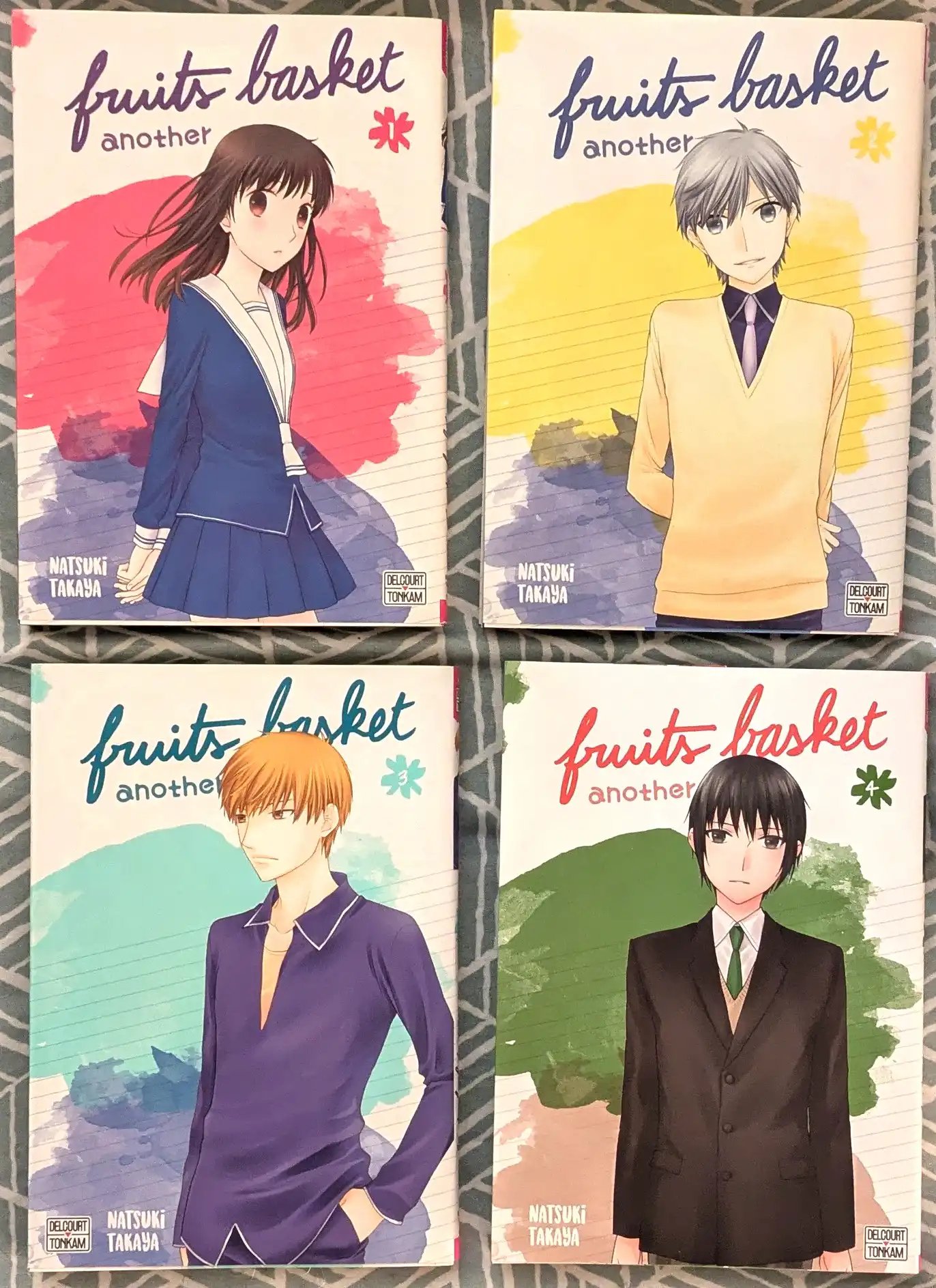 Couvertures des 4 tomes de la série Fruits Basket another de Natsuki Takaya éditée chez